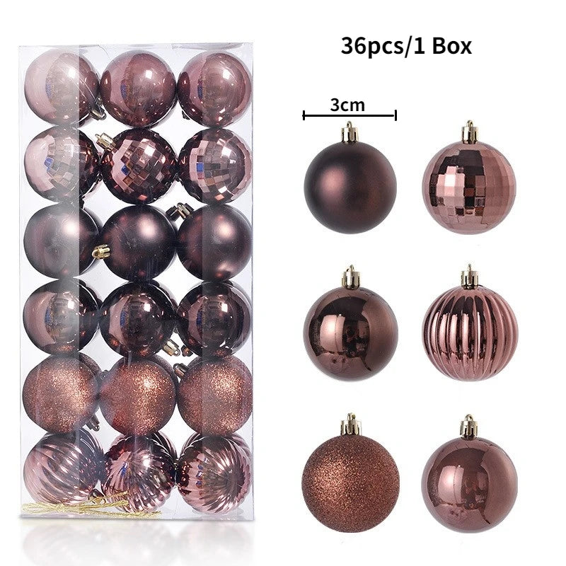A box containing 36 festive Christmas tree ornament balls in various shades of rose gold and bronze.