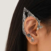 Silver elf flower leaf clip earrings worn on a woman's ear.