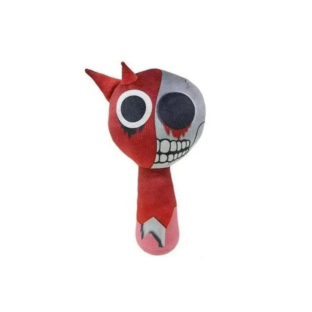 A plush toy resembling a red skull with large black eyes and teeth.