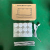 A box of vanity mirror lights with multiple round LED bulbs and accompanying wires.