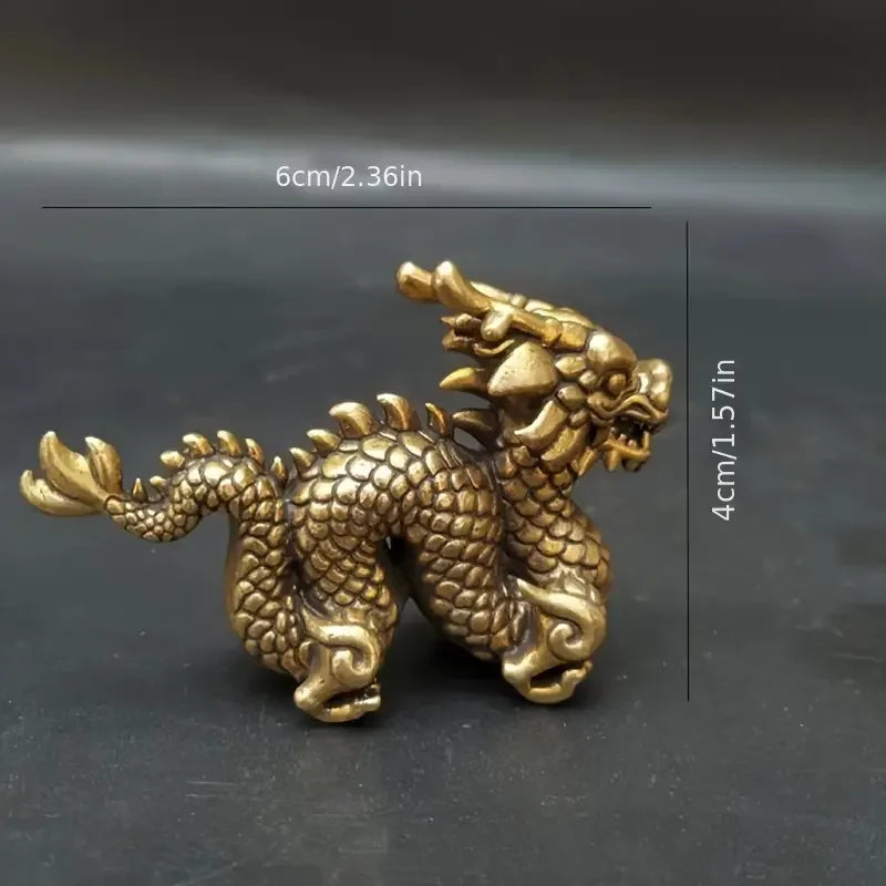 Handcrafted brass Chinese dragon statue with scales and claws, shown against a dark background.
