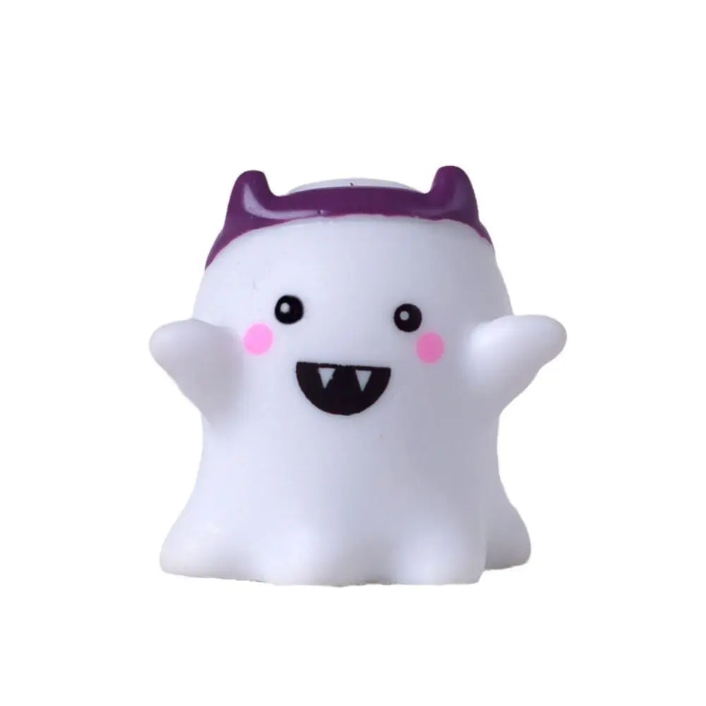A white and purple resin craft miniature ghost decor with a smiling face.