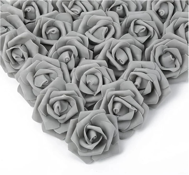 A dense arrangement of gray artificial foam rose decorations forming a heart shape.