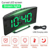 A curved LED screen alarm clock displaying 10:40 with green light, featuring functions like alarm, snooze, and night mode.