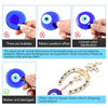 A blue eye amulet horseshoe wall hanging featuring an elephant charm