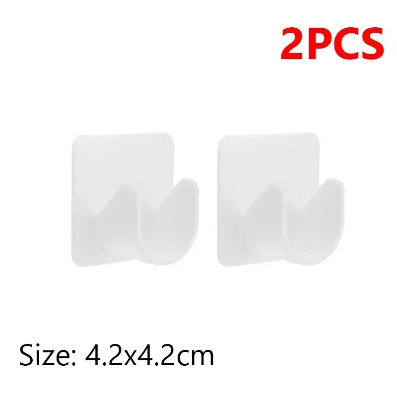 A set of two white self-adhesive curtain rod brackets with adjustable clips, measuring 4.2x4.2cm each.