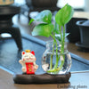 Mini resin desk ornament featuring a green ivy plant and a lucky cat in a glass vase