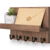 Rustic wooden wall-mounted organizer holding a letter and featuring five black hooks.