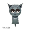 A gray balloon shaped like a cat face with large eyes and pointed ears.