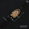A wooden Our Lady of Guadalupe pendant with a gold frame and dark brown tassel.