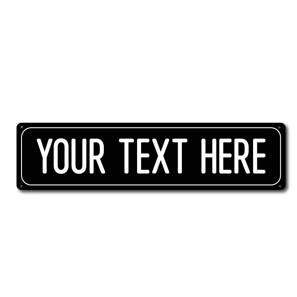 A black rectangular metal street sign with the text YOUR TEXT HERE engraved on it.