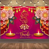A vibrant pink and gold backdrop for Diwali celebrations featuring floral designs and lit candles.