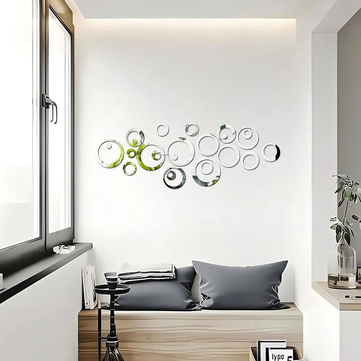 A decorative wall art piece featuring a cluster of overlapping geometric hollow circles in various shades of green and silver