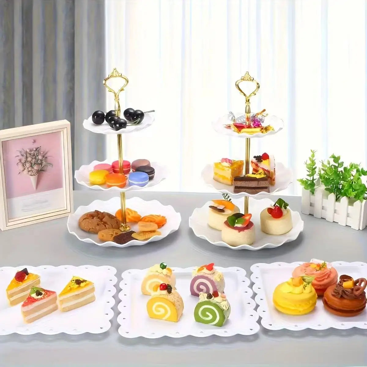 A set of decorative food trays featuring various colorful desserts and pastries on white plates.