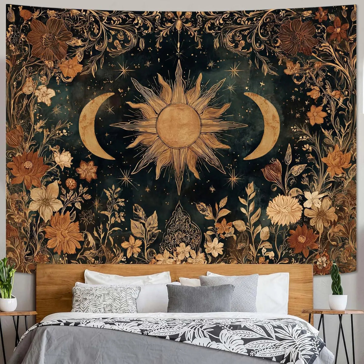 A dark tapestry featuring a vintage celestial design of a sun and moon surrounded by golden floral elements.