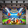 A vibrant soccer field backdrop decorated with balloons, confetti, and streamers for a birthday celebration.