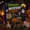 A box of Spooky Mystery Chest featuring various Halloween-themed resin figurines and pumpkins.
