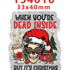A silver glitter acrylic charm featuring a skull wearing sunglasses and a Santa hat, with Christmas greenery.