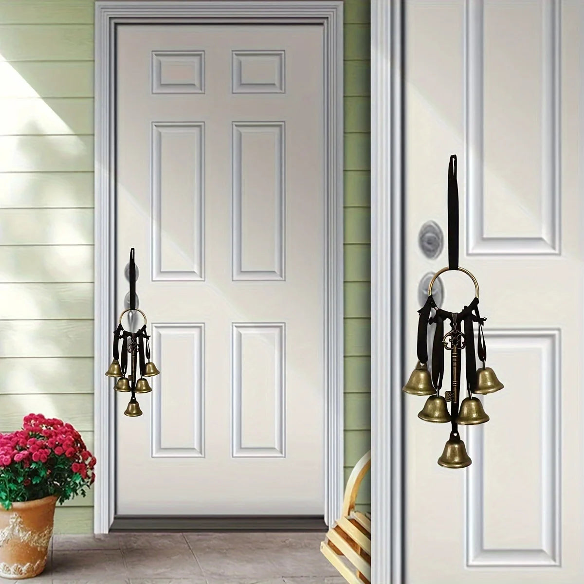 Decorative metal wind chimes hanging on a white door with a vertical frame.