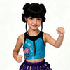 A young girl with black hair in pigtails and a pink floral top and purple skirt posing for a photo.
