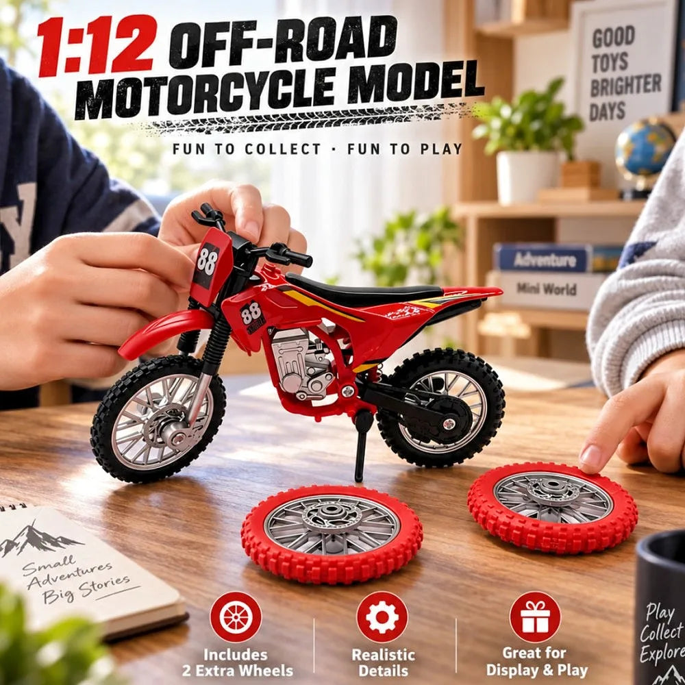 A red 1:12 scale off-road motorcycle model is shown with spare wheels and accessories on a wooden table.
