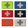 A collection of nine rectangular patches featuring a silver cross on various colored backgrounds including lime green, blue, 