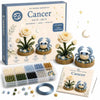 A box of a DIY beaded garden kit for Cancer featuring flowers and a crab, along with loose beads and a step-by-step guide.