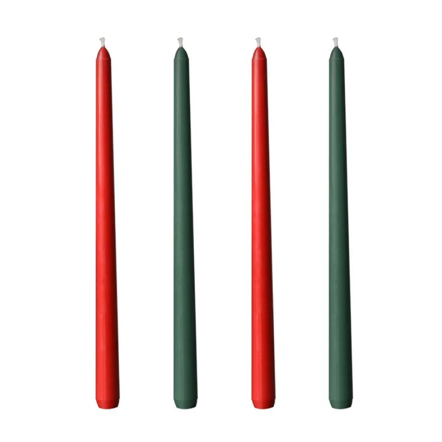 A set of four long taper candles in gradient colors, including red and green.