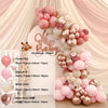 A kit of pink and beige balloons arranged in a floral garland arch display.