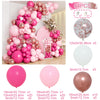 A large arrangement of pink and rose gold latex balloons for celebrations, including various sizes and colors.