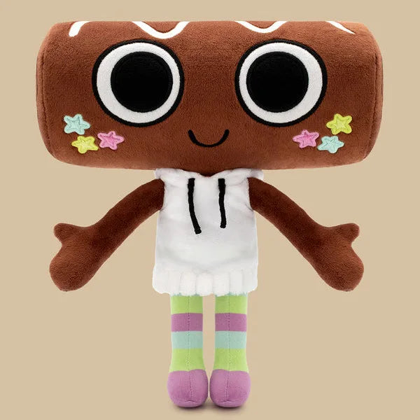 A brown plush toy with large black eyes and pink star accents, wearing a white top and striped legs.