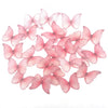 A collection of pink butterfly-shaped cupcake toppers.