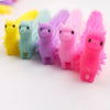 A set of five colorful, purple and pink stretch sensory fidget toys arranged in a row.