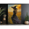 Canvas wall art depicting a dark witch with long hair wearing a wide-brimmed hat in an autumnal field.