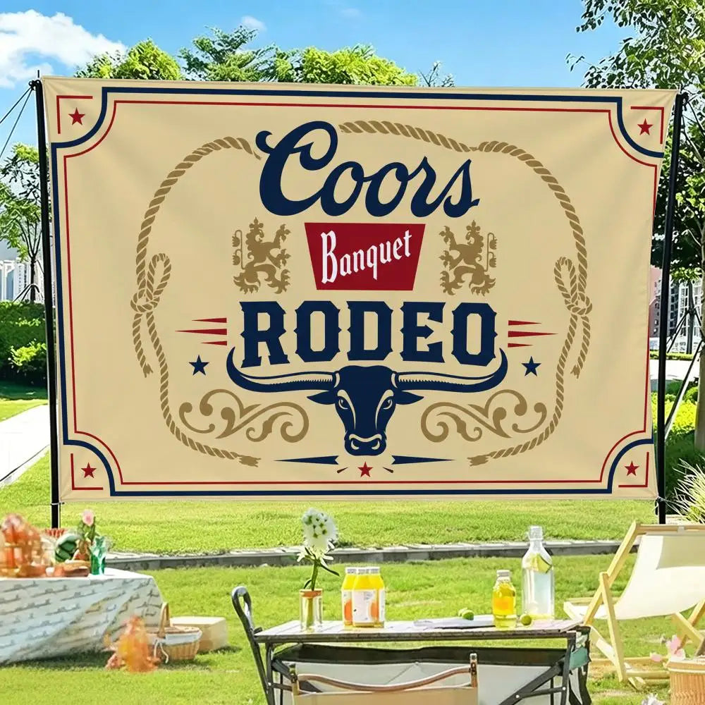 A beige banner featuring the text Coors Banquet Rodeo in dark blue and red, displayed outdoors.