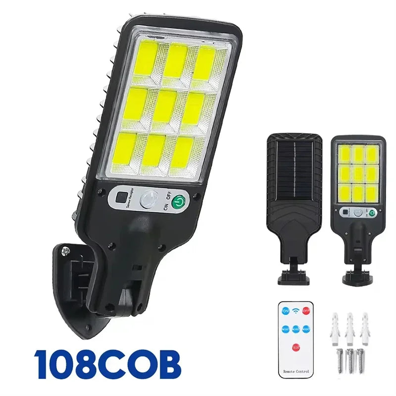 A black solar-powered motion sensor LED security light with a remote control and multiple light units.