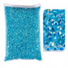 A bag of bright turquoise blue resin rhinestones with flatbacks and varying sizes.