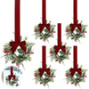 A 10-inch artificial Christmas wreath decorated with red berries and a velvet bow on a red ribbon.