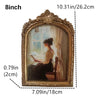 An oval vintage resin photo frame with a gold-colored ornate frame and a painting inside.