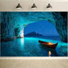 A vibrant turquoise sea cave entrance with a wooden boat floating in the clear blue water.