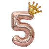 Rose gold foil balloon shaped like the number 5 with a gold crown on top