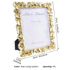 A gold-bordered photo frame with a white mat, featuring a Ginkgo leaf design.