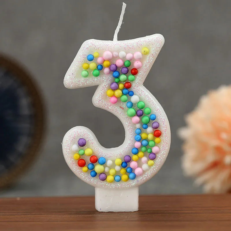 Glitter number 3 birthday candle decorated with colorful candy beads