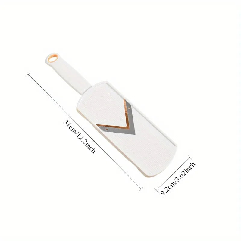 White manual cabbage shredder with stainless steel blades shown from the side.