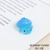 A small, translucent blue resin charm shaped like a fruit turtle for DIY crafts.