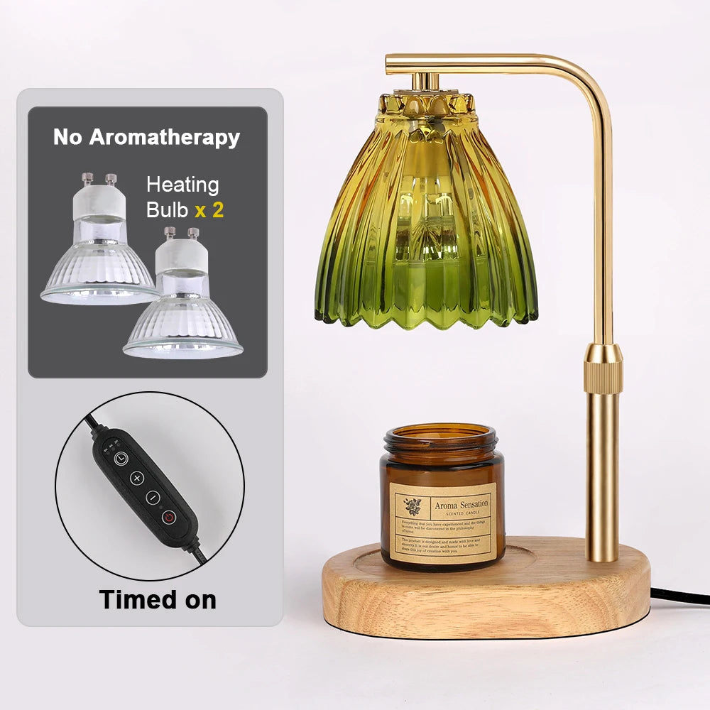 A brass adjustable candle warmer lamp with a glass shade and heating bulbs, shown next to a timer and a wooden base.