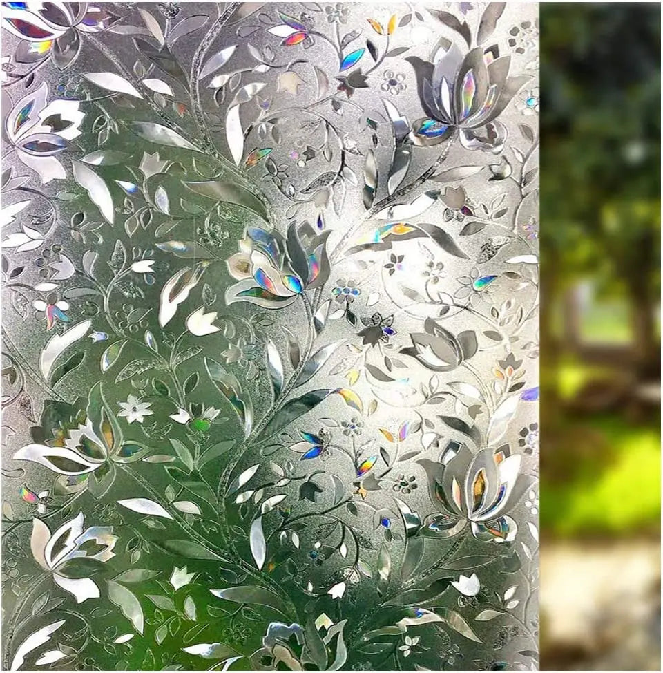 Close-up of frosted window privacy film featuring a delicate floral pattern on a glass surface.
