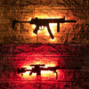 A glowing orange and red LED gun-shaped wall decor light mounted on a brick surface.
