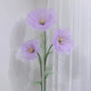A large artificial silk purple poppy flower with a green stand against a white background.