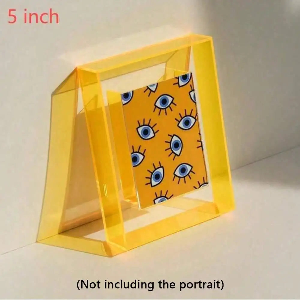A clear yellow acrylic photo frame with a patterned message board inside.